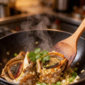 Conch meat cooking with herbs